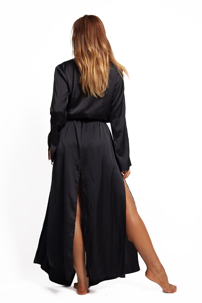 model wears long sleeve full length black silk satin dressing gown robe